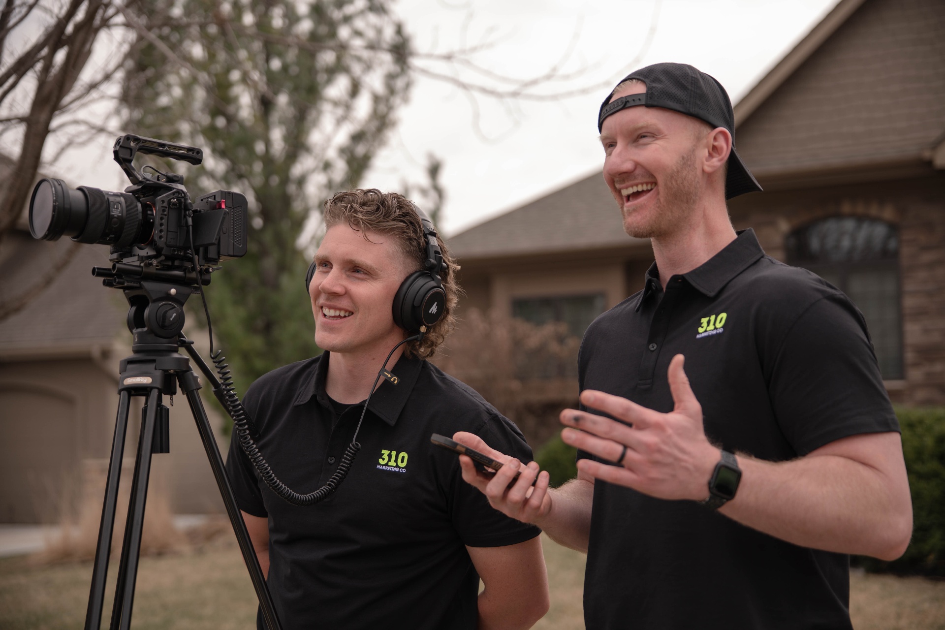 Landon and Zach, the owners of 310 Marketing Co, filming on location for a client